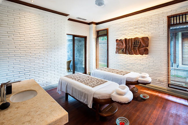 Ironwood decks the floor of each new villa's spa treatment room, nestled between the indoor living space and outdoor bathing area.